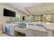 Community bar with granite countertop and dual sinks at 3360 Chestertown Loop, Bradenton, FL 34211