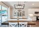 Elegant dining room with chandelier and access to backyard patio at 3360 Chestertown Loop, Bradenton, FL 34211