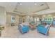 Open community room with seating areas and kitchen access at 3360 Chestertown Loop, Bradenton, FL 34211