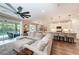 Open concept living area with sectional sofa and pool view at 3360 Chestertown Loop, Bradenton, FL 34211