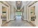 Bright hallway with tile floors and access to community rooms at 3360 Chestertown Loop, Bradenton, FL 34211