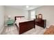Charming bedroom with a wooden bed and dresser at 3360 Chestertown Loop, Bradenton, FL 34211