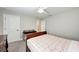 Bedroom with a desk and a bed featuring geometric bedding at 3360 Chestertown Loop, Bradenton, FL 34211