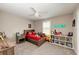 bedroom with a comfortable bed, shelves, and a fun atmosphere at 3360 Chestertown Loop, Bradenton, FL 34211