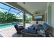 Outdoor entertainment area with a pool, patio, and TV at 3360 Chestertown Loop, Bradenton, FL 34211