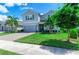 Two-story house with gray siding and a landscaped yard at 3360 Chestertown Loop, Bradenton, FL 34211