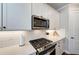 Modern kitchen features stainless steel appliances and white shaker cabinets at 3360 Chestertown Loop, Bradenton, FL 34211