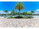 Resort-style pool with lounge chairs and palm trees providing shade at 3360 Chestertown Loop, Bradenton, FL 34211