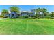 Community clubhouse with lush landscaping at 3360 Chestertown Loop, Bradenton, FL 34211