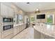 Stainless steel appliances and granite counters in a community kitchen at 3360 Chestertown Loop, Bradenton, FL 34211