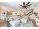 Large living room with sectional sofa and view of kitchen and stairs at 3360 Chestertown Loop, Bradenton, FL 34211