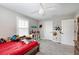 Bright bedroom with a red bed and plenty of storage at 3360 Chestertown Loop, Bradenton, FL 34211