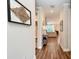 Bright entry hall with wood-look floors and view into living area at 3360 Chestertown Loop, Bradenton, FL 34211