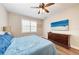Comfortable bedroom with a dresser, TV, and beautiful beach view at 3360 Chestertown Loop, Bradenton, FL 34211