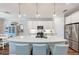 Modern kitchen island with white cabinets and pendant lighting at 3360 Chestertown Loop, Bradenton, FL 34211