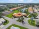 Aerial view of community with pool, tennis courts, and pond at 4224 Madeira Ct # 3309, Sarasota, FL 34233