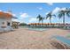 Inviting community pool with surrounding lounge chairs at 4224 Madeira Ct # 3309, Sarasota, FL 34233