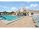 Relaxing community pool area with surrounding patio at 4224 Madeira Ct # 3309, Sarasota, FL 34233