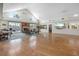 Spacious community room with hardwood floors, fireplace, and seating areas at 4224 Madeira Ct # 3309, Sarasota, FL 34233