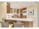 Modern kitchen with stainless steel appliances and a breakfast bar at 915 Seaside Dr # 312 Weeks 8-9, Sarasota, FL 34242