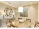 Elegant dining room with a round table and four chairs at 915 Seaside Dr # 312 Weeks 8-9, Sarasota, FL 34242