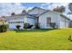 Single-story home with a two-car garage and well-maintained lawn at 6933 43Rd E Ct, Sarasota, FL 34243