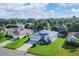 Aerial view of a light blue house with a large yard at 6933 43Rd E Ct, Sarasota, FL 34243
