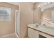 Bathroom with vanity, shower, and mirror at 6933 43Rd E Ct, Sarasota, FL 34243