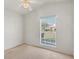 Bright bedroom with window and neutral decor at 6933 43Rd E Ct, Sarasota, FL 34243