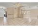 Bright living room with tile flooring and a view into the kitchen at 6933 43Rd E Ct, Sarasota, FL 34243