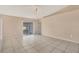 Spacious living area with tile floors and access to a screened patio at 6933 43Rd E Ct, Sarasota, FL 34243