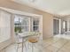 Small breakfast nook with a table and chairs by a large window at 6933 43Rd E Ct, Sarasota, FL 34243