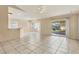 Bright dining area with tile floor and sliding glass doors to patio at 6933 43Rd E Ct, Sarasota, FL 34243