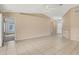 Living room with tile floors and neutral-colored walls at 6933 43Rd E Ct, Sarasota, FL 34243