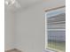 Bedroom with window, ceiling fan and neutral walls at 6933 43Rd E Ct, Sarasota, FL 34243