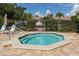 Relaxing community hot tub with surrounding patio at 5956 Clubside Dr # 7651, Sarasota, FL 34243