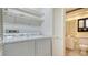 Laundry room with washer, dryer, and shelving at 5956 Clubside Dr # 7651, Sarasota, FL 34243