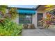 Private front patio with lush tropical landscaping at 5956 Clubside Dr # 7651, Sarasota, FL 34243