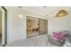 Spacious screened patio with outdoor furniture and view of lush greenery at 5956 Clubside Dr # 7651, Sarasota, FL 34243