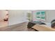 Bright bedroom with wood-look floors and access to backyard at 5956 Clubside Dr # 7651, Sarasota, FL 34243