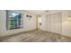 Bedroom with wood-look floors and built-in storage at 5956 Clubside Dr # 7651, Sarasota, FL 34243