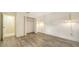 Simple bedroom with wood-look floors and large closet at 5956 Clubside Dr # 7651, Sarasota, FL 34243