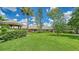Community features lush green lawn and gazebo at 5956 Clubside Dr # 7651, Sarasota, FL 34243