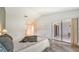 Bedroom with patio access and grey wood-look floors at 5956 Clubside Dr # 7651, Sarasota, FL 34243
