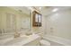 Clean bathroom with shower/tub, vanity, and linen cabinet at 5956 Clubside Dr # 7651, Sarasota, FL 34243