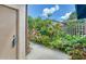 Landscaped side yard with walkway and privacy fence at 5956 Clubside Dr # 7651, Sarasota, FL 34243