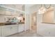Kitchen features granite countertops and white cabinets at 5956 Clubside Dr # 7651, Sarasota, FL 34243