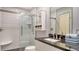 Updated bathroom with a large walk-in shower and modern fixtures at 5956 Clubside Dr, Sarasota, FL 34243