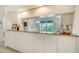 Kitchen with granite countertops and pass-through to dining area at 5956 Clubside Dr # 7651, Sarasota, FL 34243