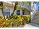 Condo building exterior with lush landscaping at 4640 Tower Hill Ln # 2316, Sarasota, FL 34238